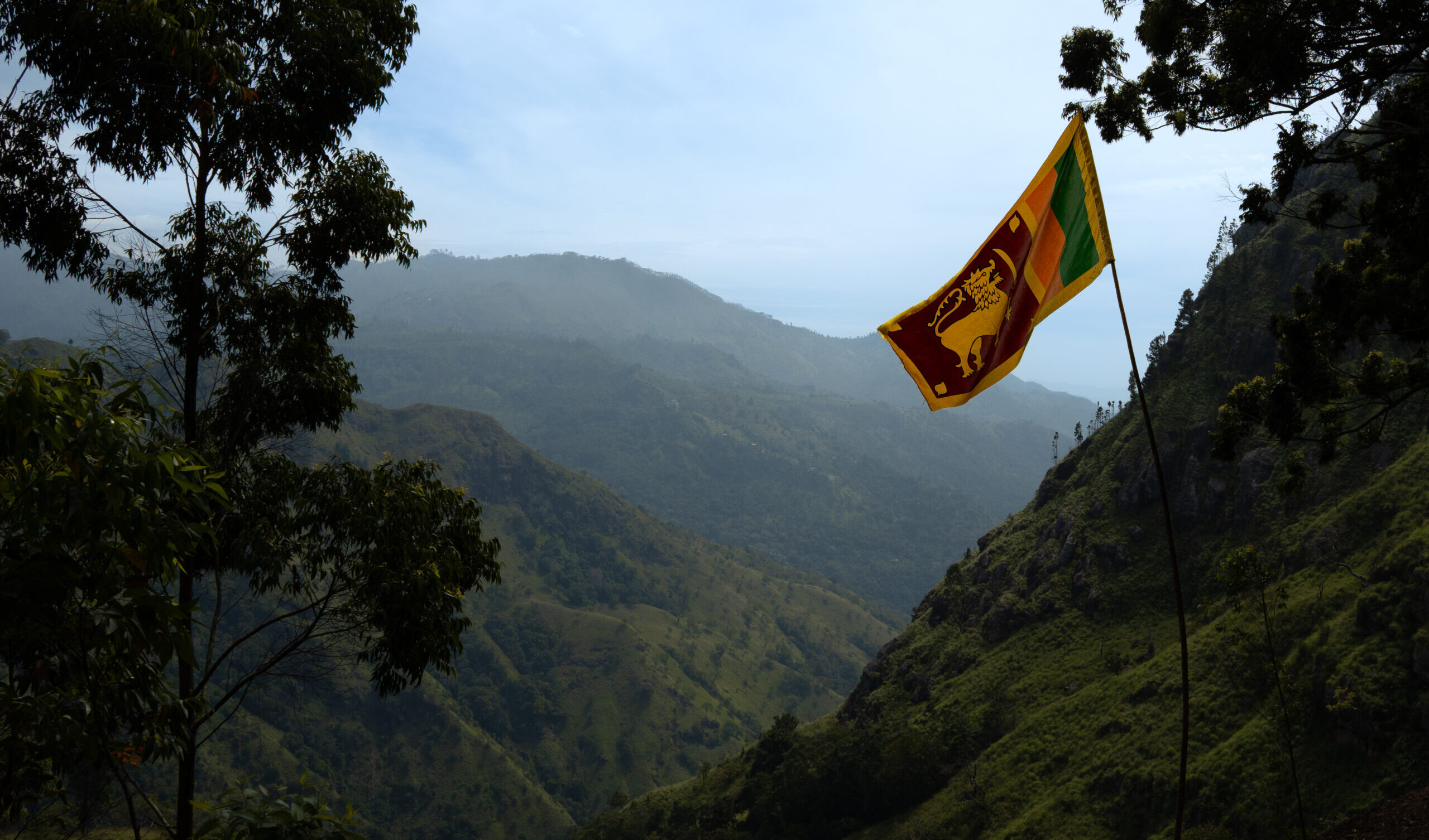 Free views in Ella of the surrounding nature with the Sri Lankan flag, a budget-friendly activity