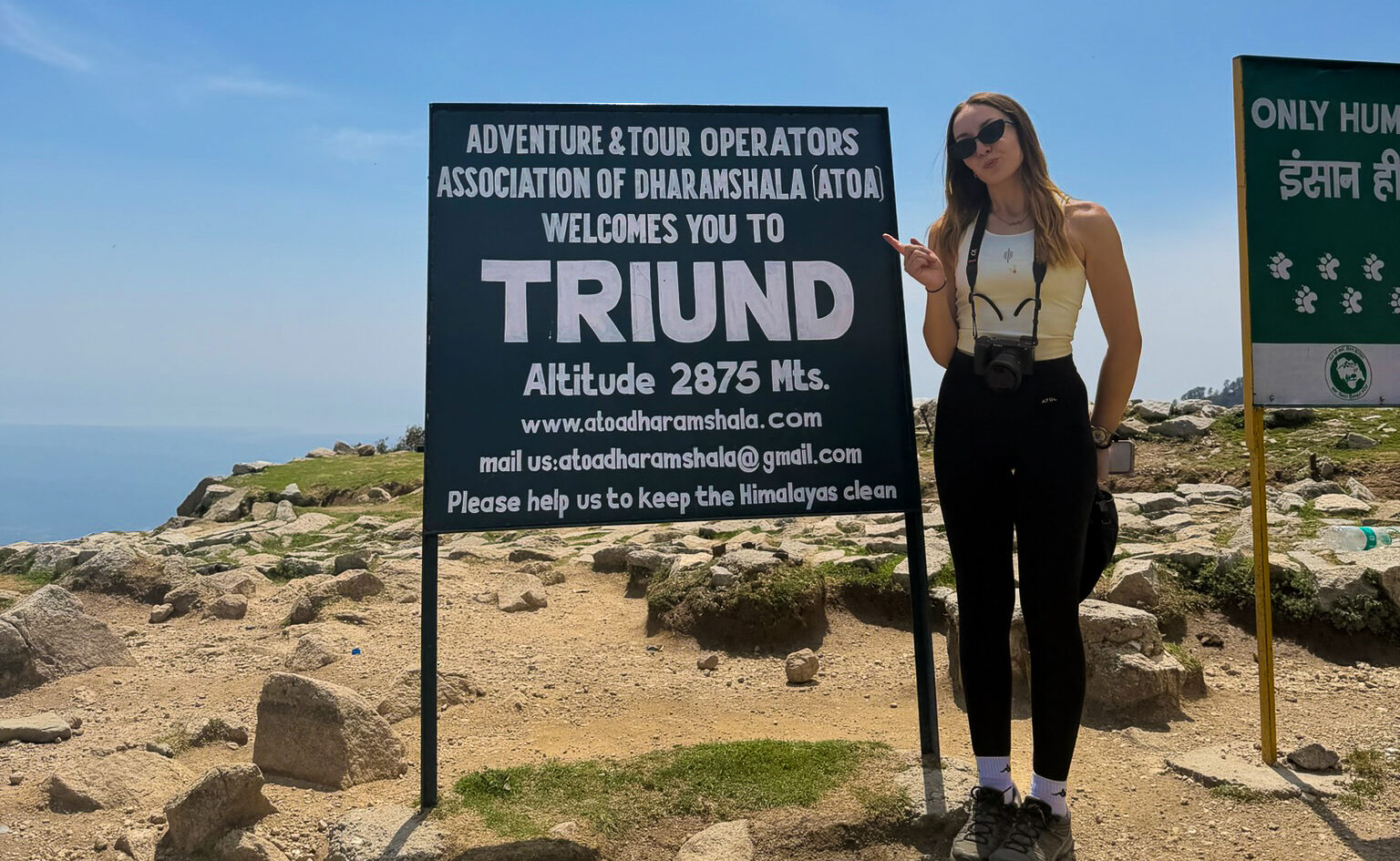 The sign at the top after the Triund Trek showing the destination and height of the mountain