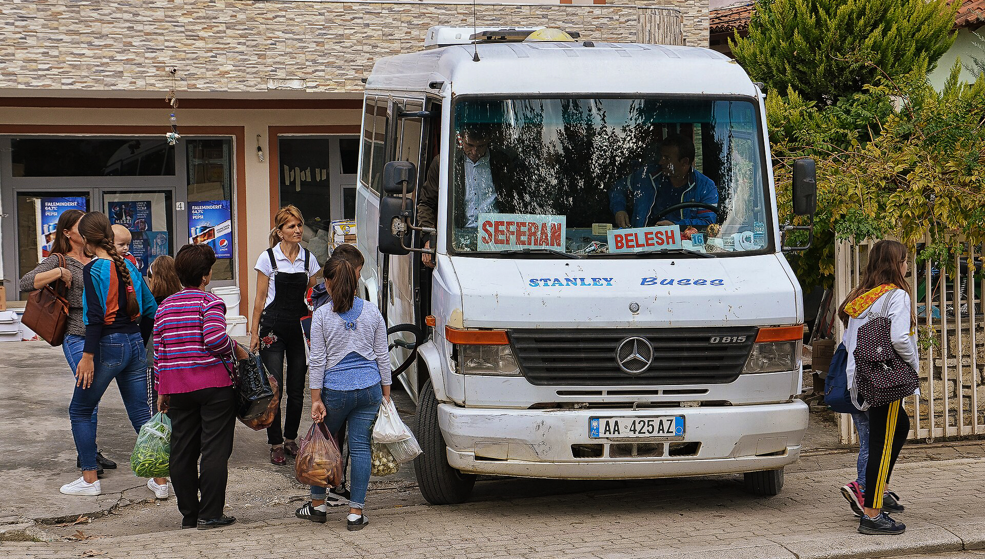 Locals waiting for the common transport of the iconic furgon