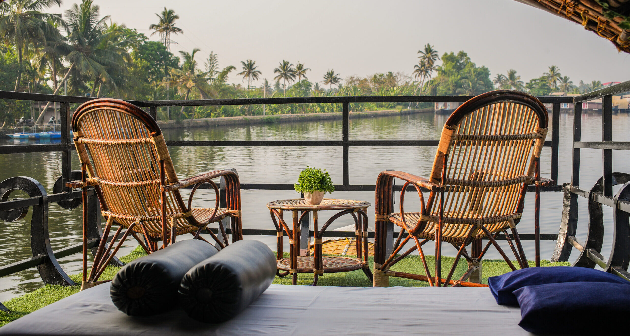 Deck chairs on the rooftop of the houseboat sailing through the backwaters of Alleppey