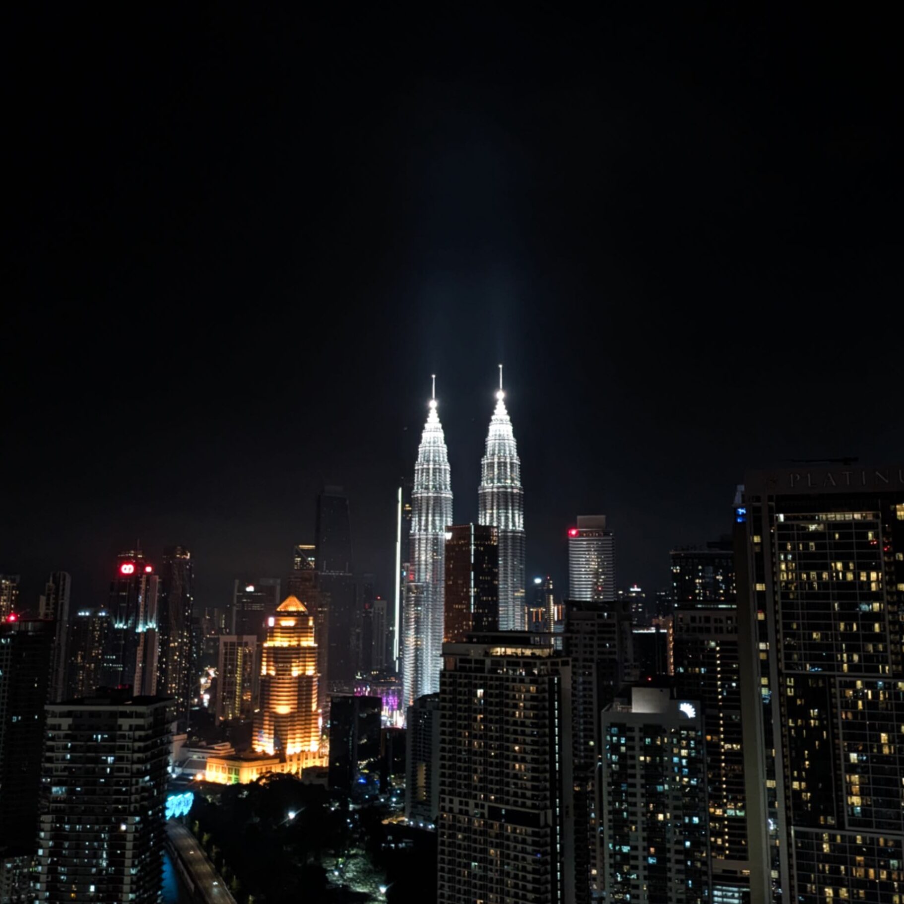 The gorgeous, illuminated skyline of Kuala Lumpur, Malaysia at night.