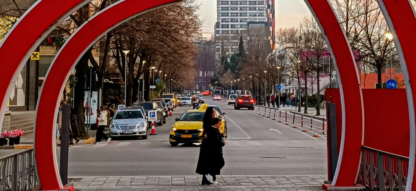 Taxis driving through the capital city of Albania, Tirana