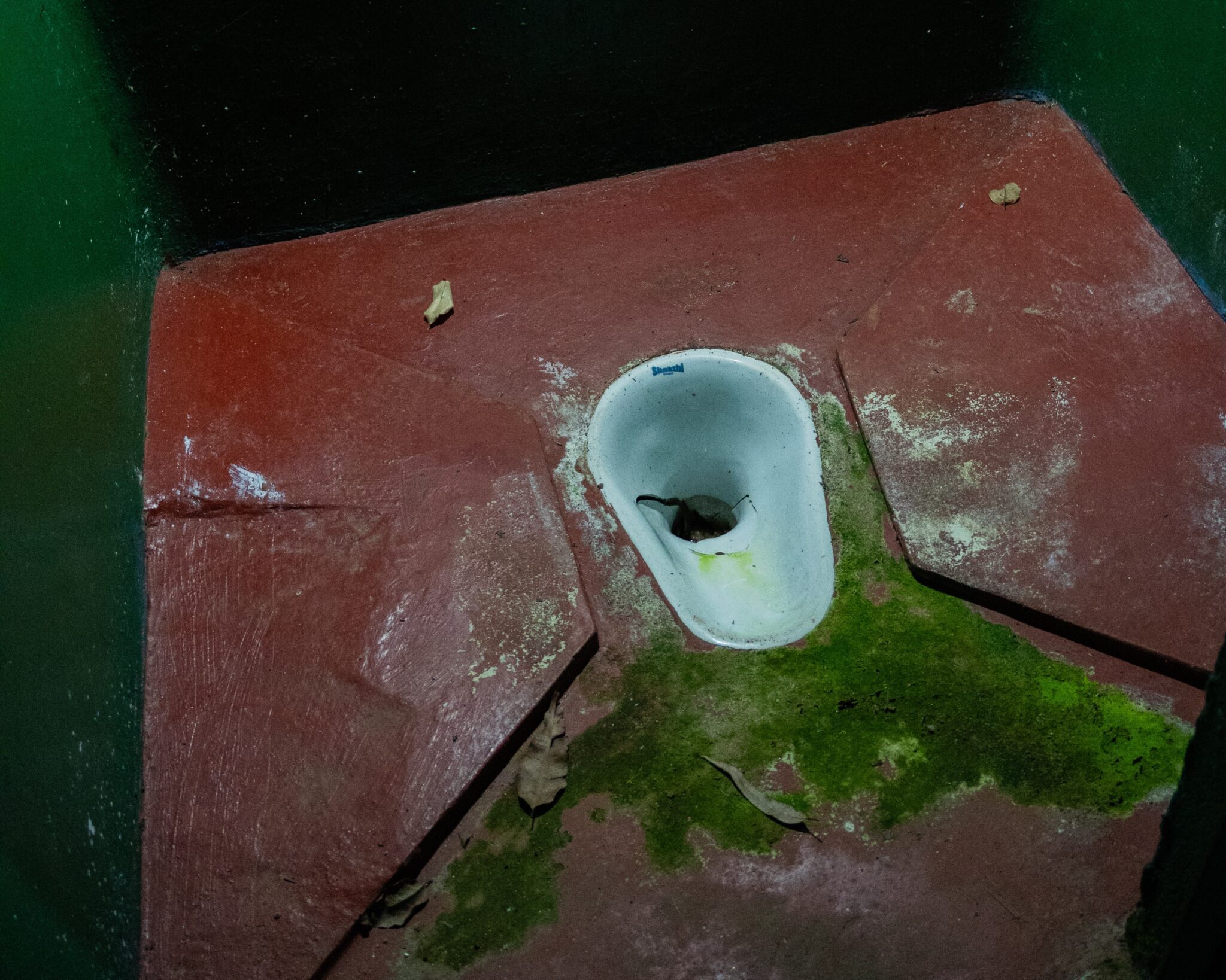 A squat toilet located in the toilet block on a trail to Adam's Peak in Sri Lanka