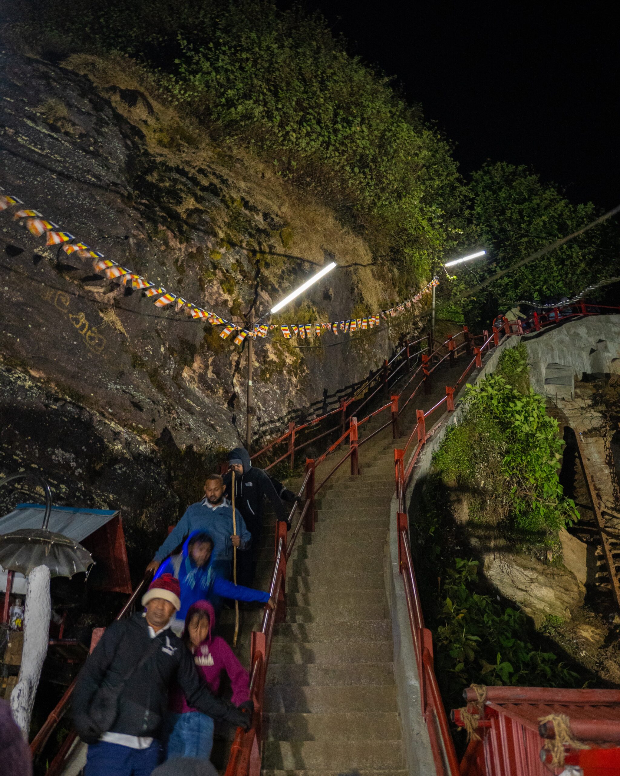 A set of steep, narrow stairs heading up the side of a mountain - Sri Pada (Adam's Peak) in Sri Lanka.