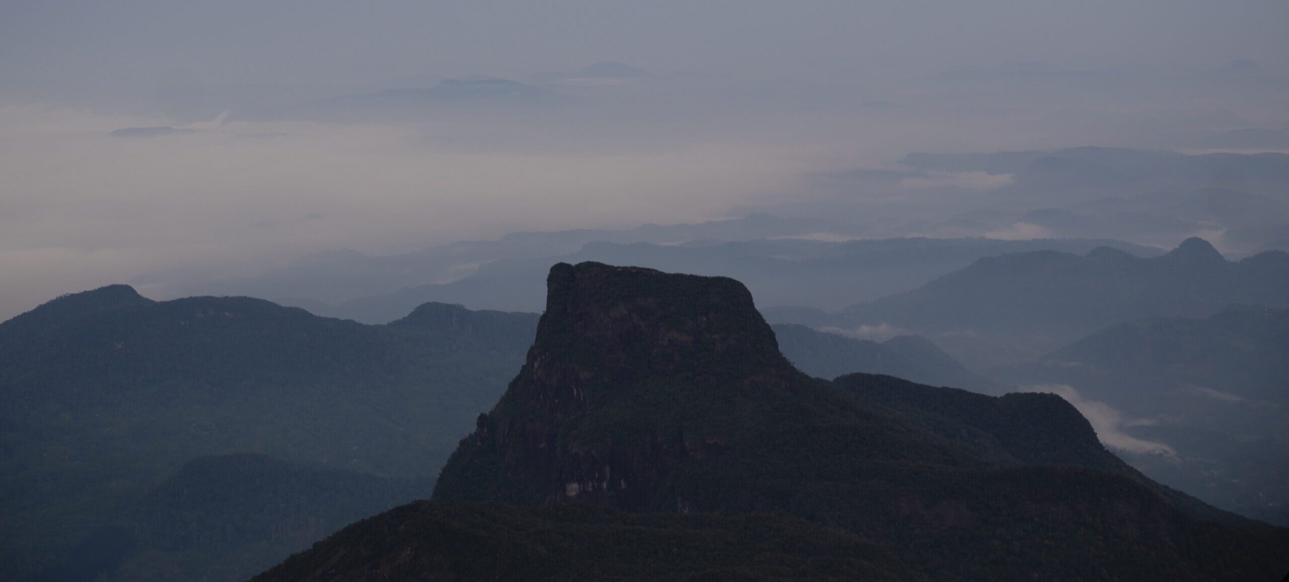 Misty mountain views from the top of Adam's Peak (Sri Pada) in Sri Lanka