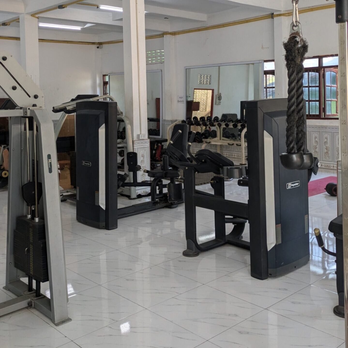 A gym typical of Southeast Asia with machines and free weights