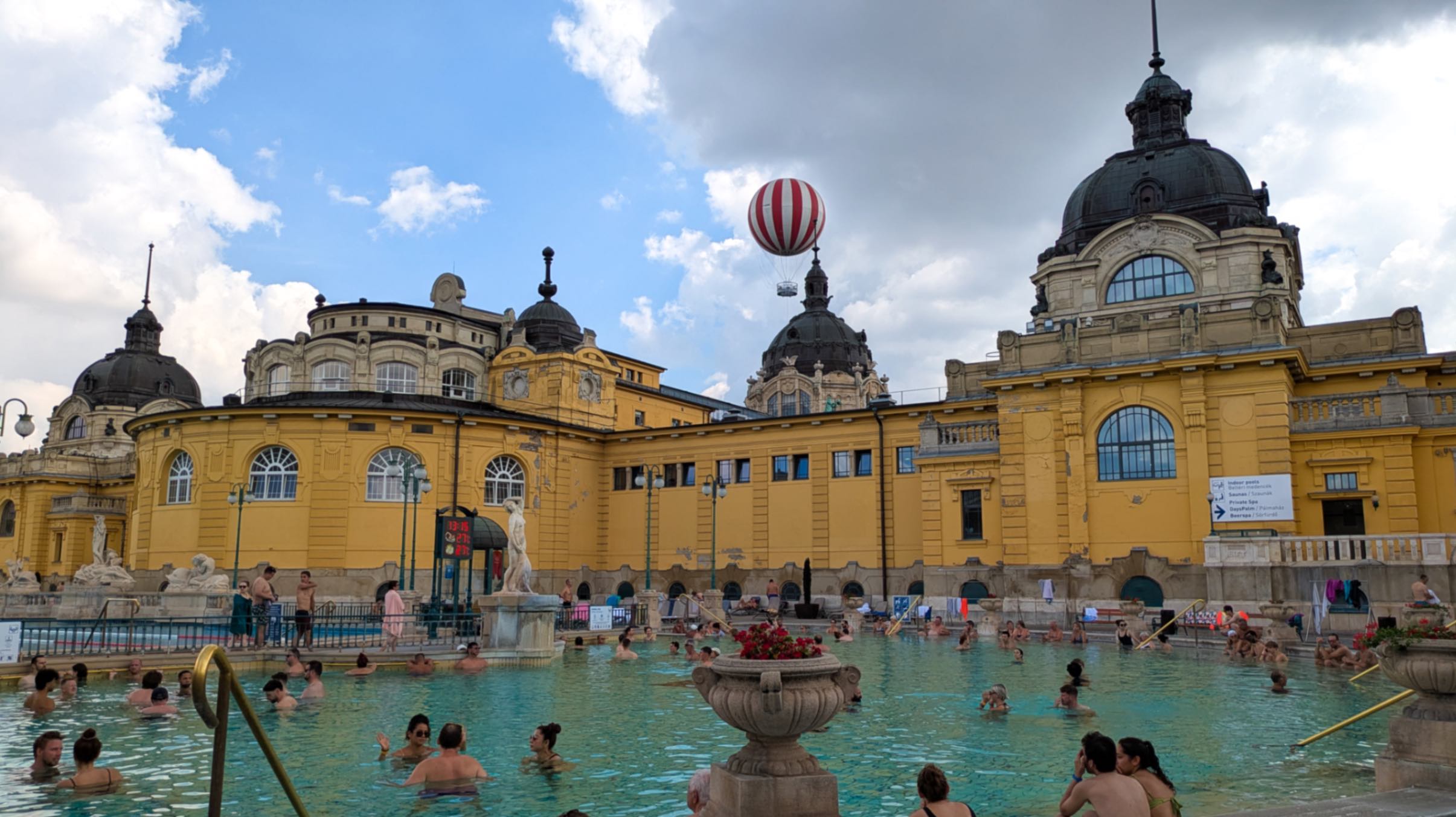 The famous Széchenyi Thermal Baths in Budapest, a popular thing to do when visiting - filled with locals and tourists