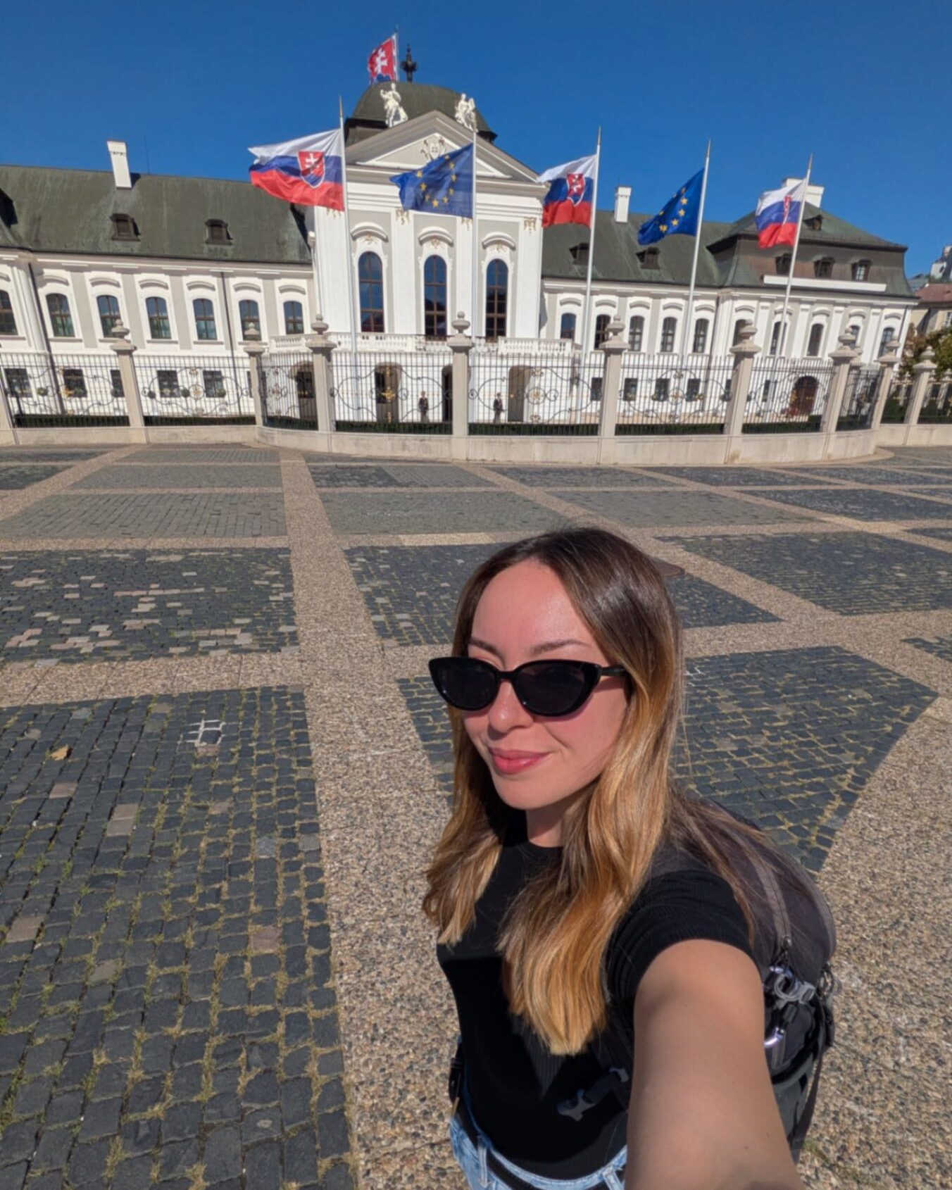 A women stood in front of the presidential building in Bratislava, Slovakia