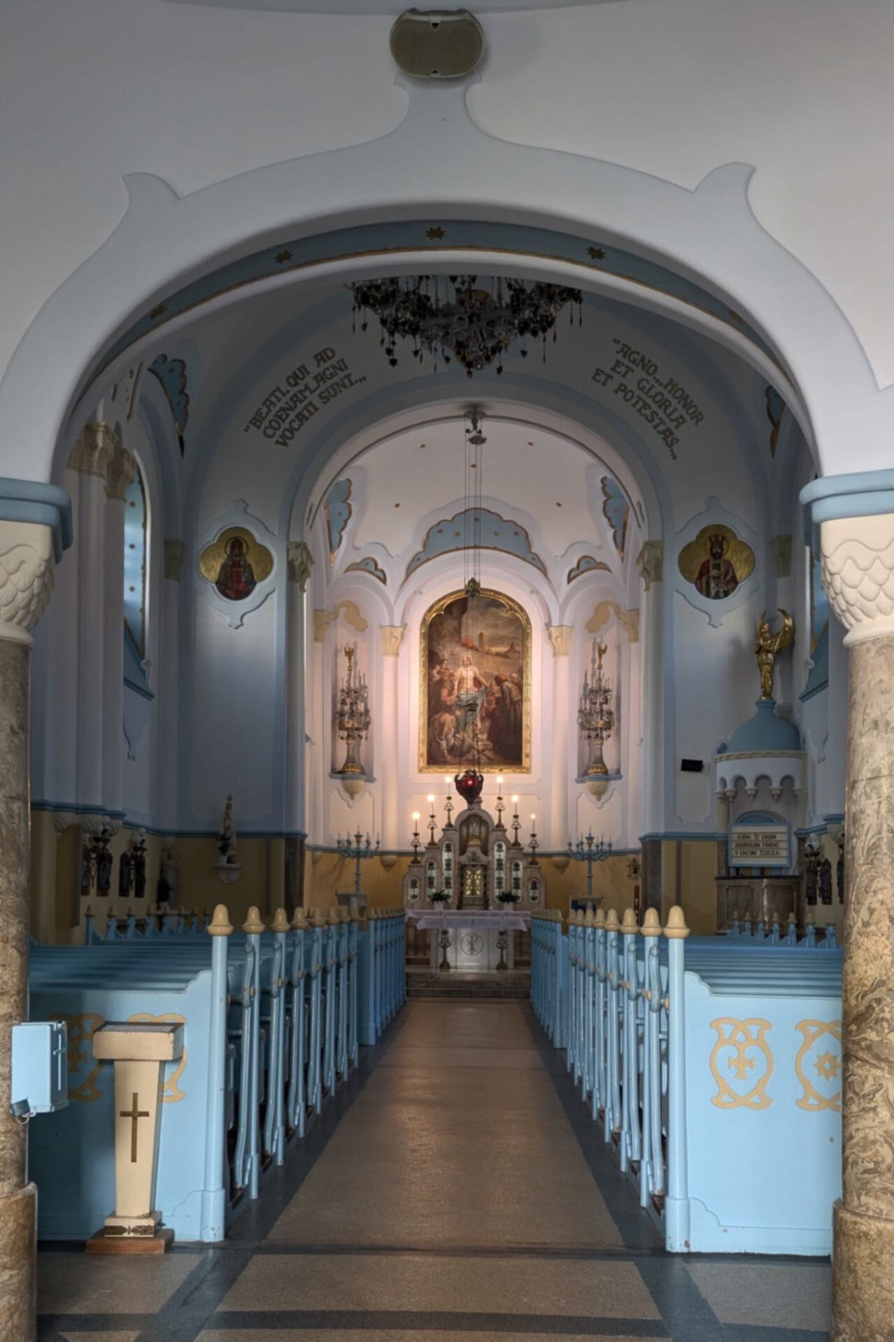 The interior of the Blue Church in Bratislava, Slovakia featuring a pale blue and white interior