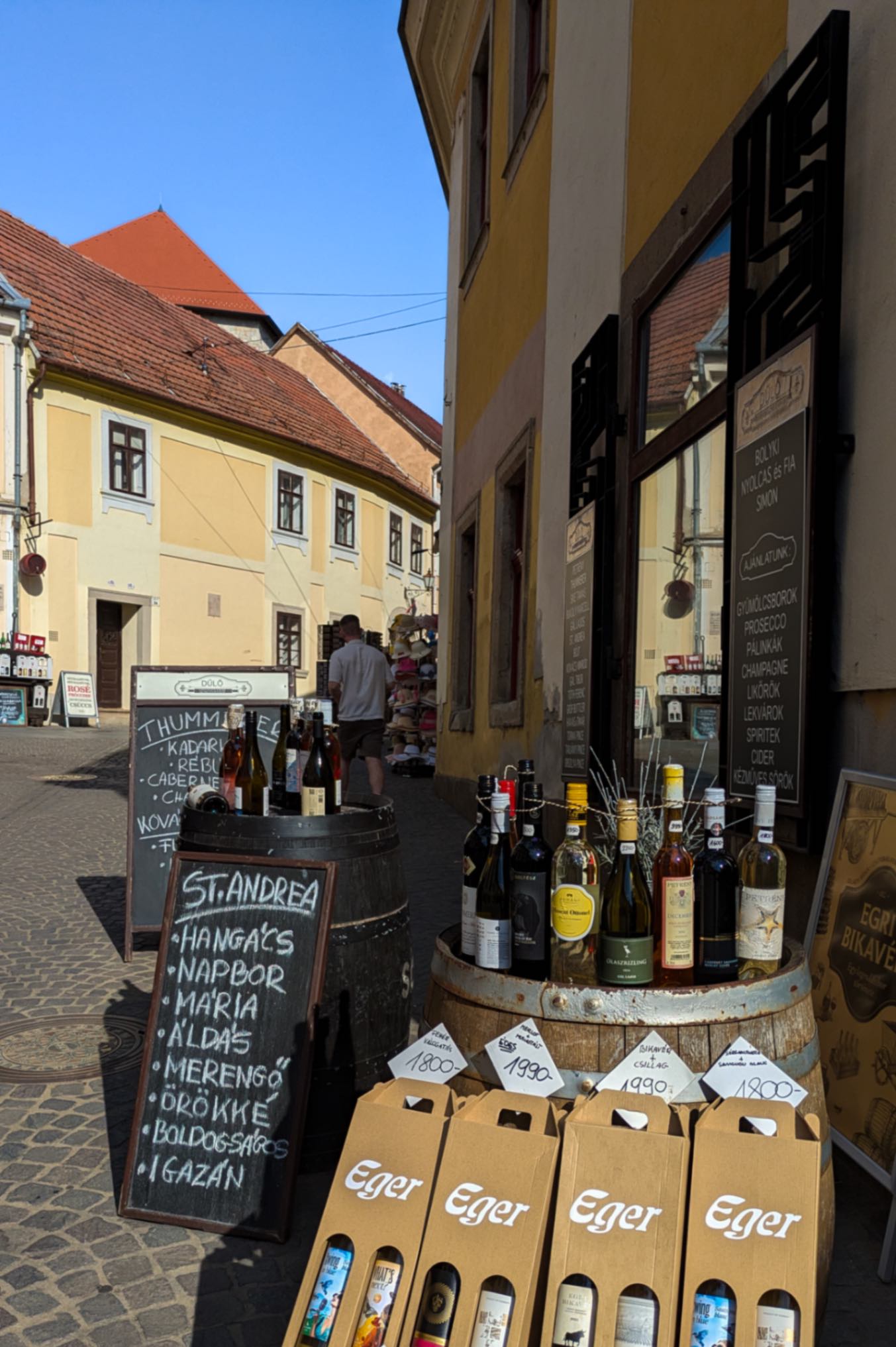 Wine for sale on a typical Central European street with a warm sun glow