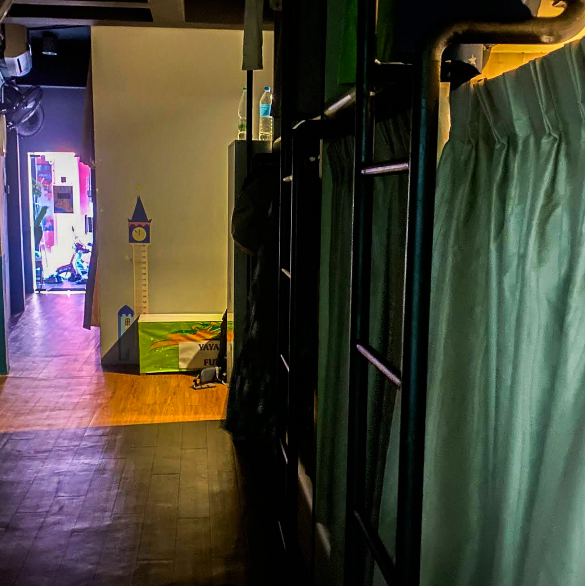A bunk bed hostel, in a dark and gloomy setting