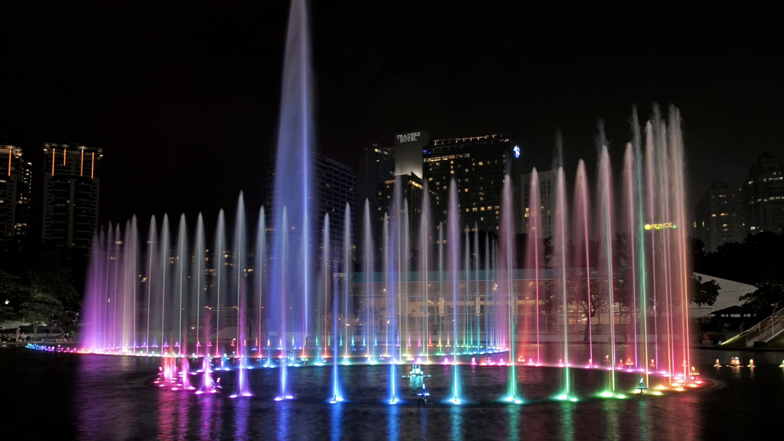 KLCC park showing a light show right next to the iconic Petronas Towers, Kuala Lumpur