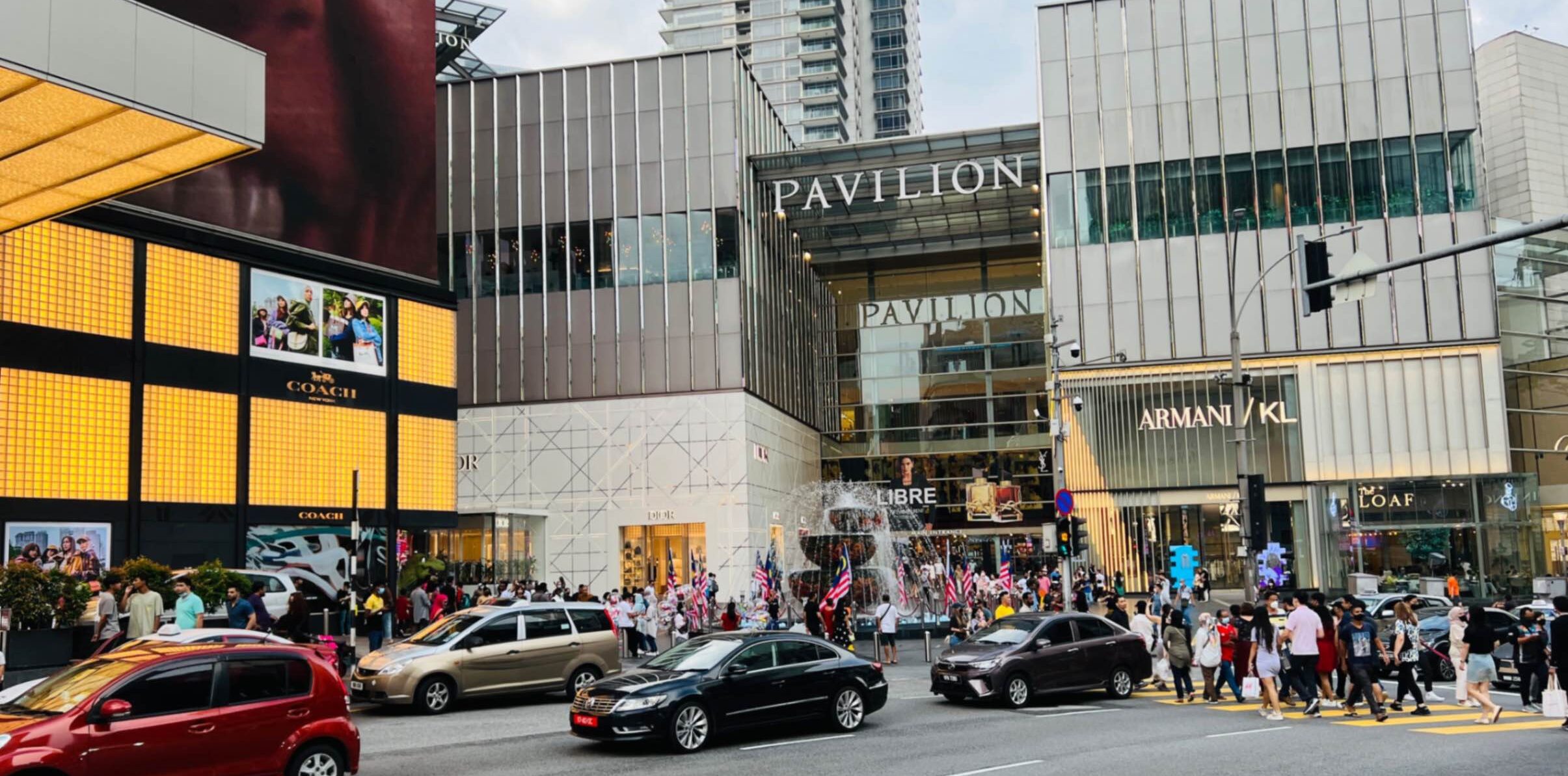 The busy streets of Kuala Lumpur, Malaysia with the Pavillon Mall behind, a popular spot for luxury shopping