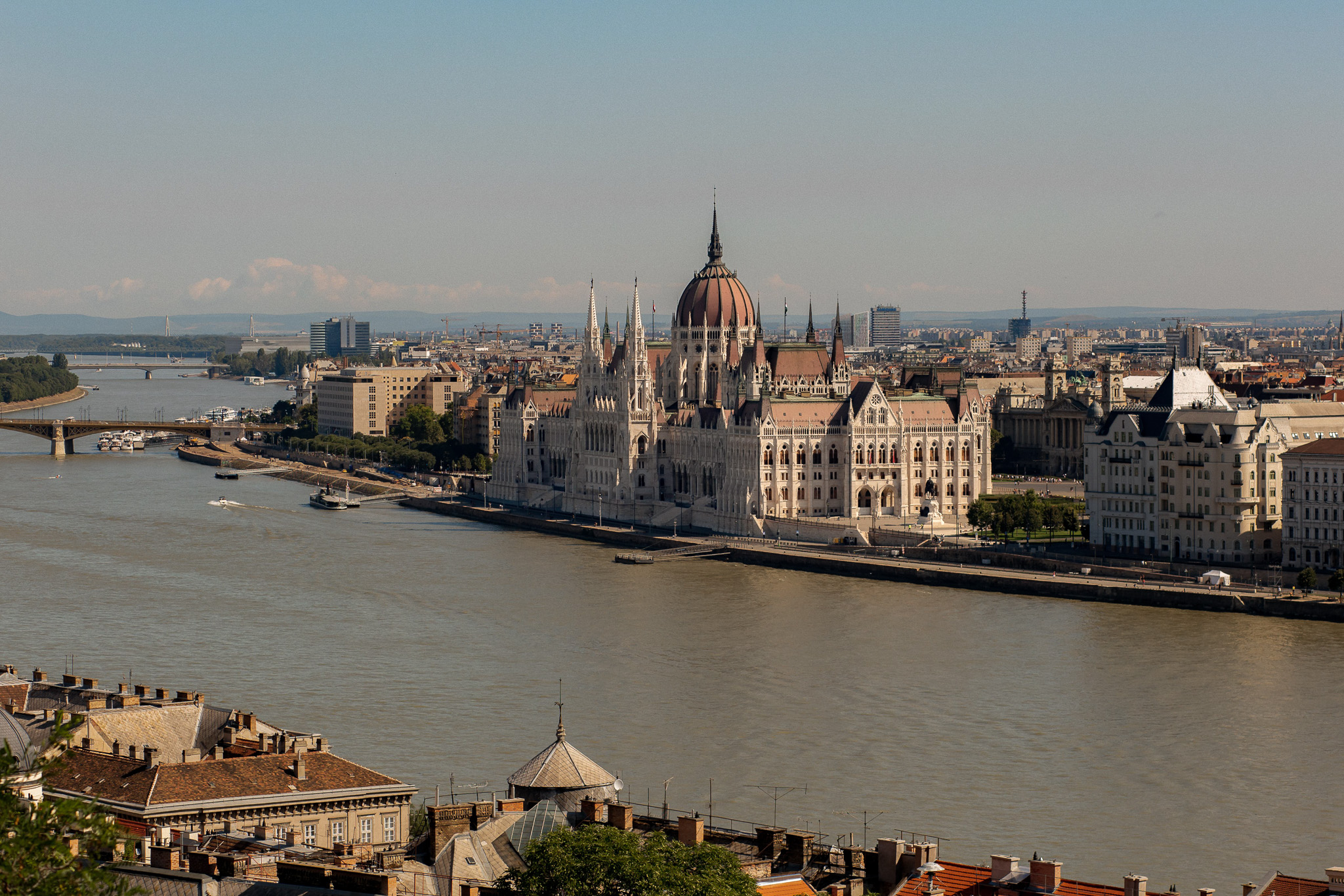 A photo taken from an elevated position of the Hungarian parliament building which sits on the edge of the Danube River.
