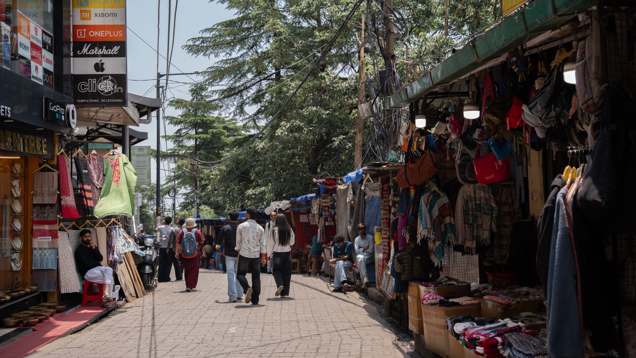 A market street filled with stalls and shops in McLeod Ganj, Dharamshala