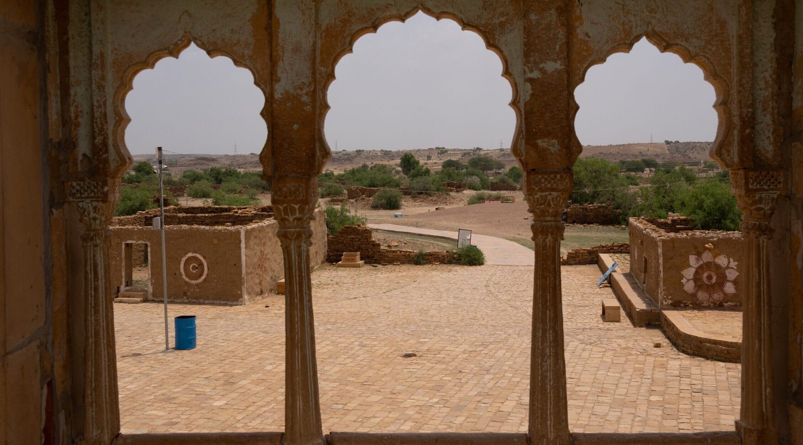 A photo from inside a traditional Rajasthani building looking out over the desert landscapes