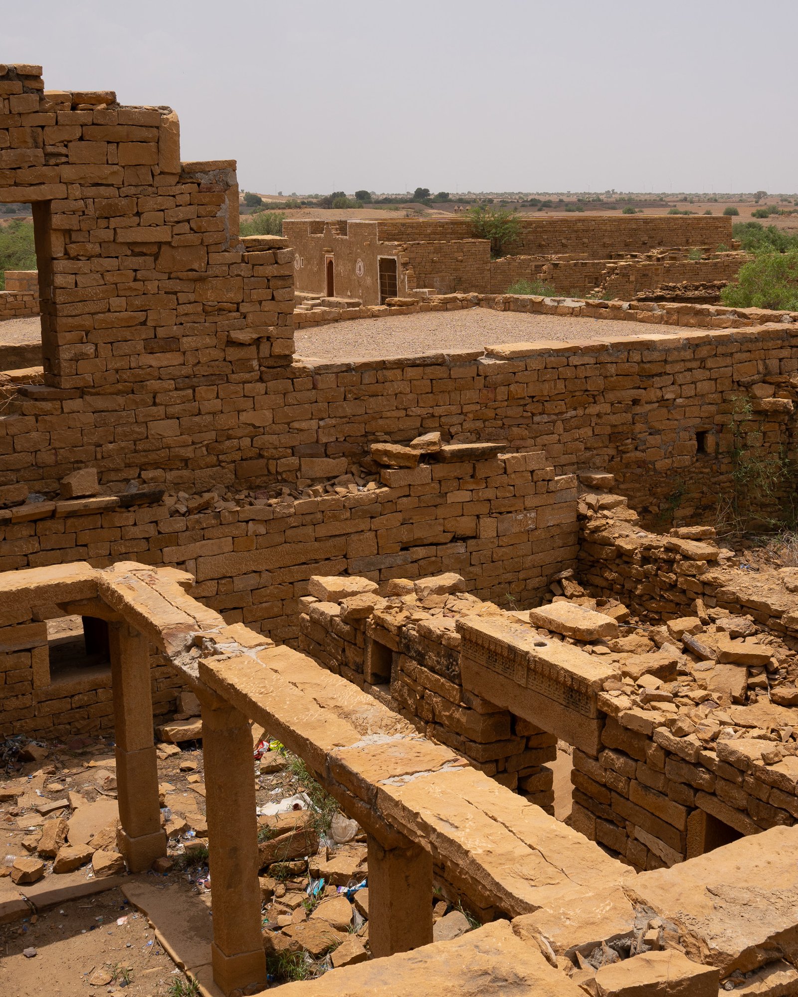 Sandstone structures crumbled, with some walls still standing - the remains of Kuldhara village