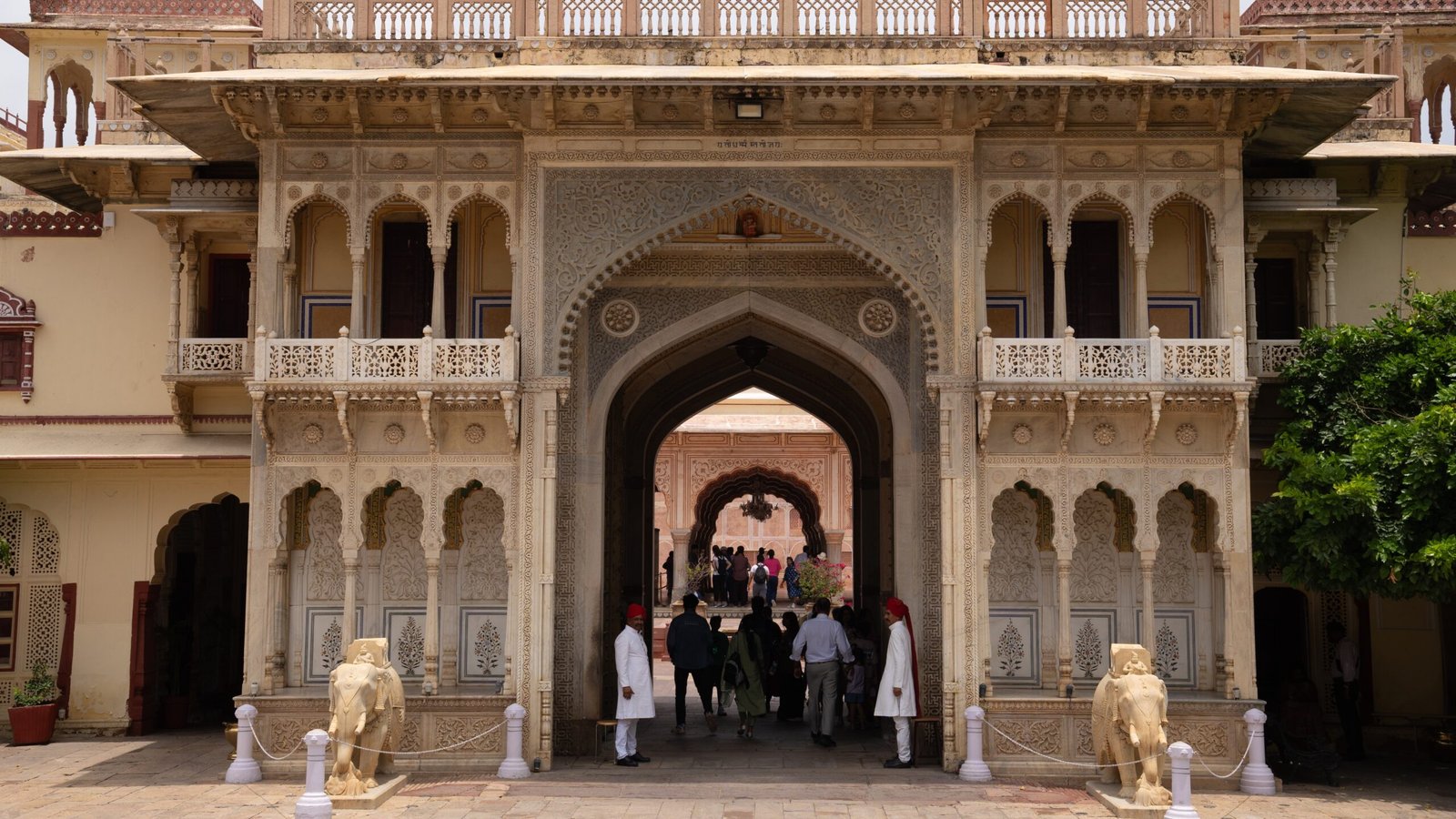Guards on a grande building's doors in a Rajasthani setting