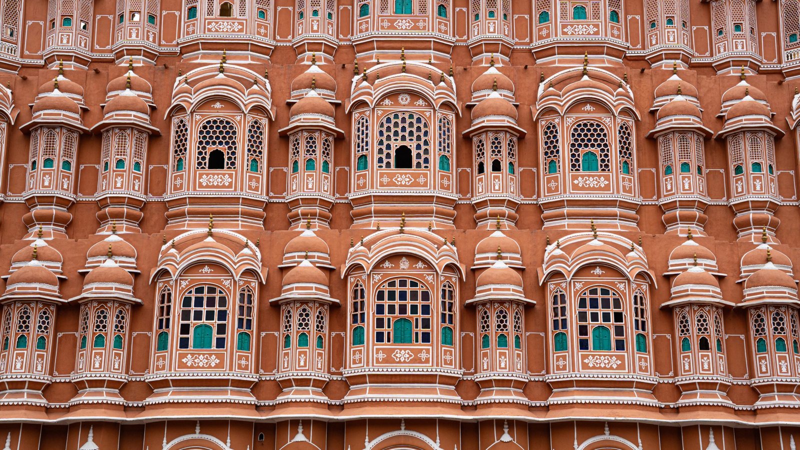 A lot of windows on an orangey building of Hawa Mahal