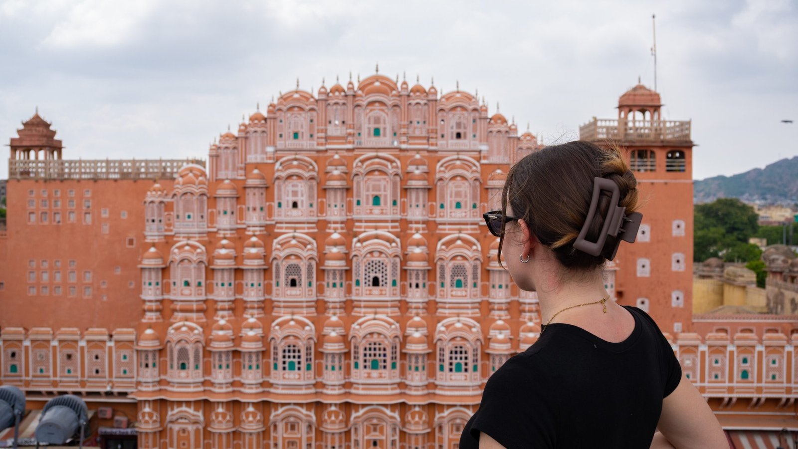 A women stood looking out at Jawa Mahal - one of the most popular things to do in Jaipur