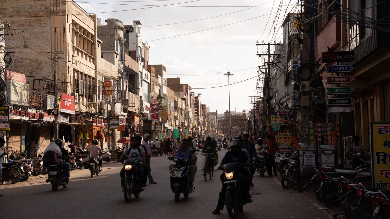 A busy street in Bikaner featuring motorcycles and