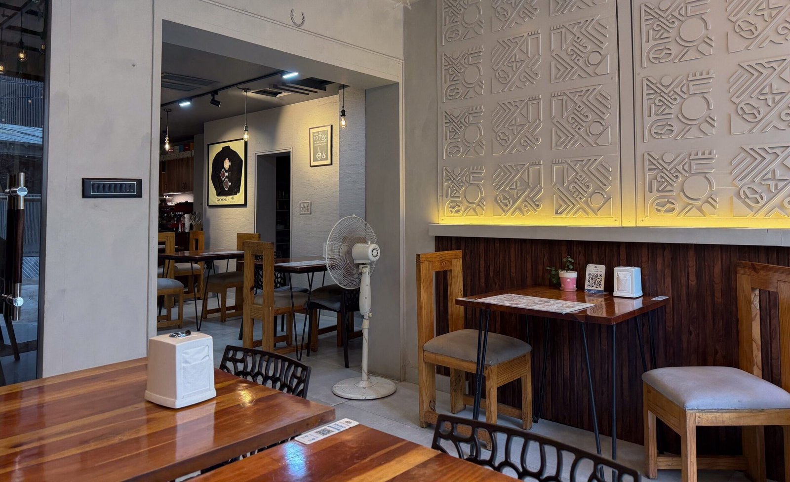 A modern cafe with lights and tables