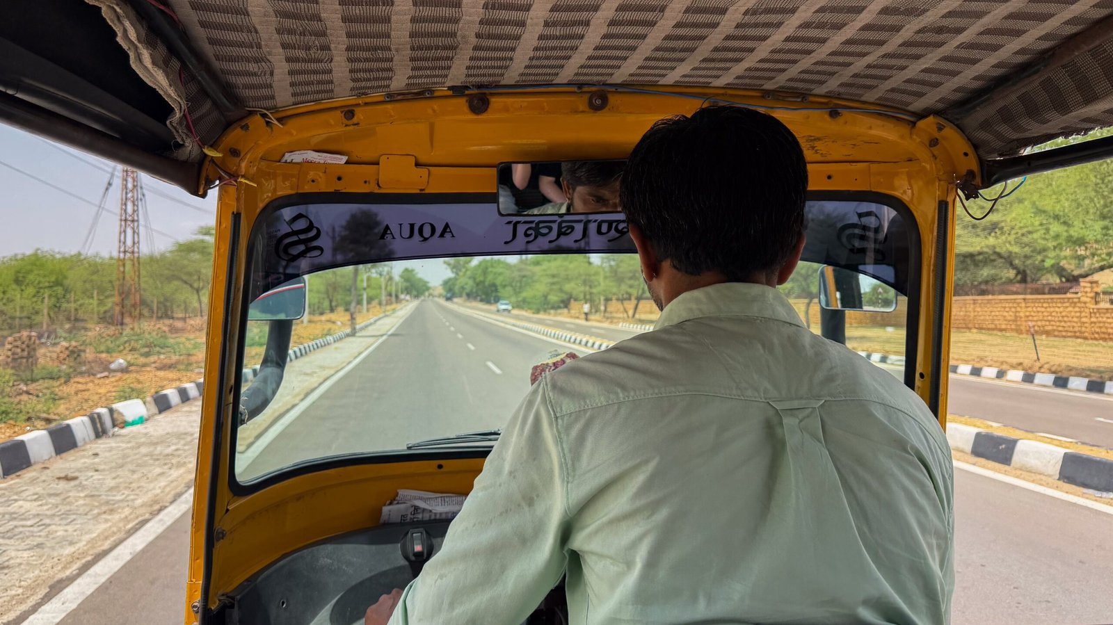A tuktuk or auto-rickshaw driver on roads leading to a desert in Jaisalmer