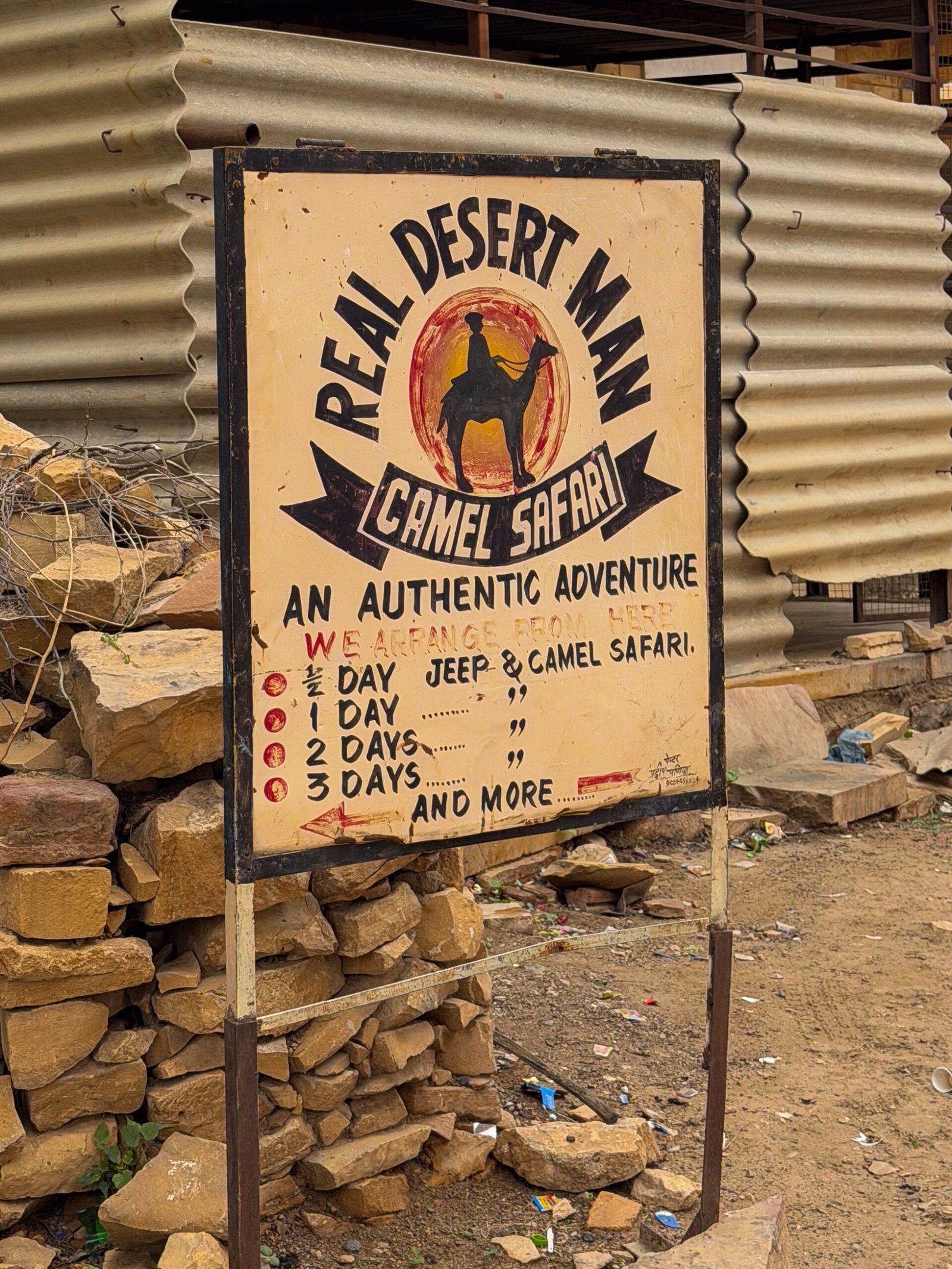 A sign reading "Real Desert Man"