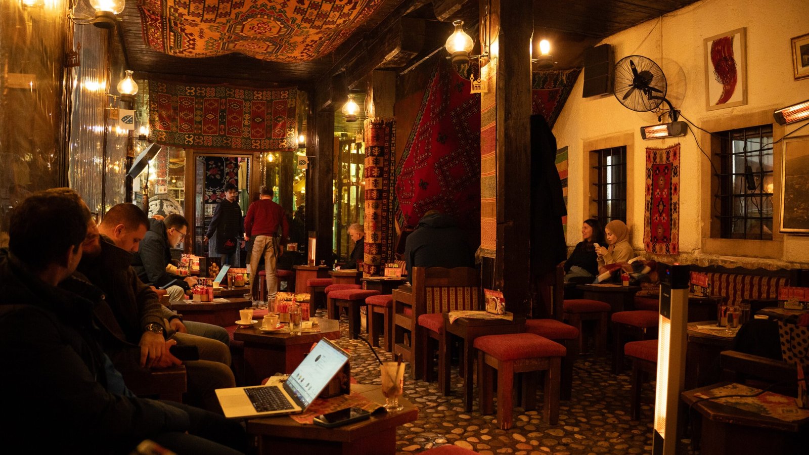 The inside of a cafe in Bosnia with warm architecture