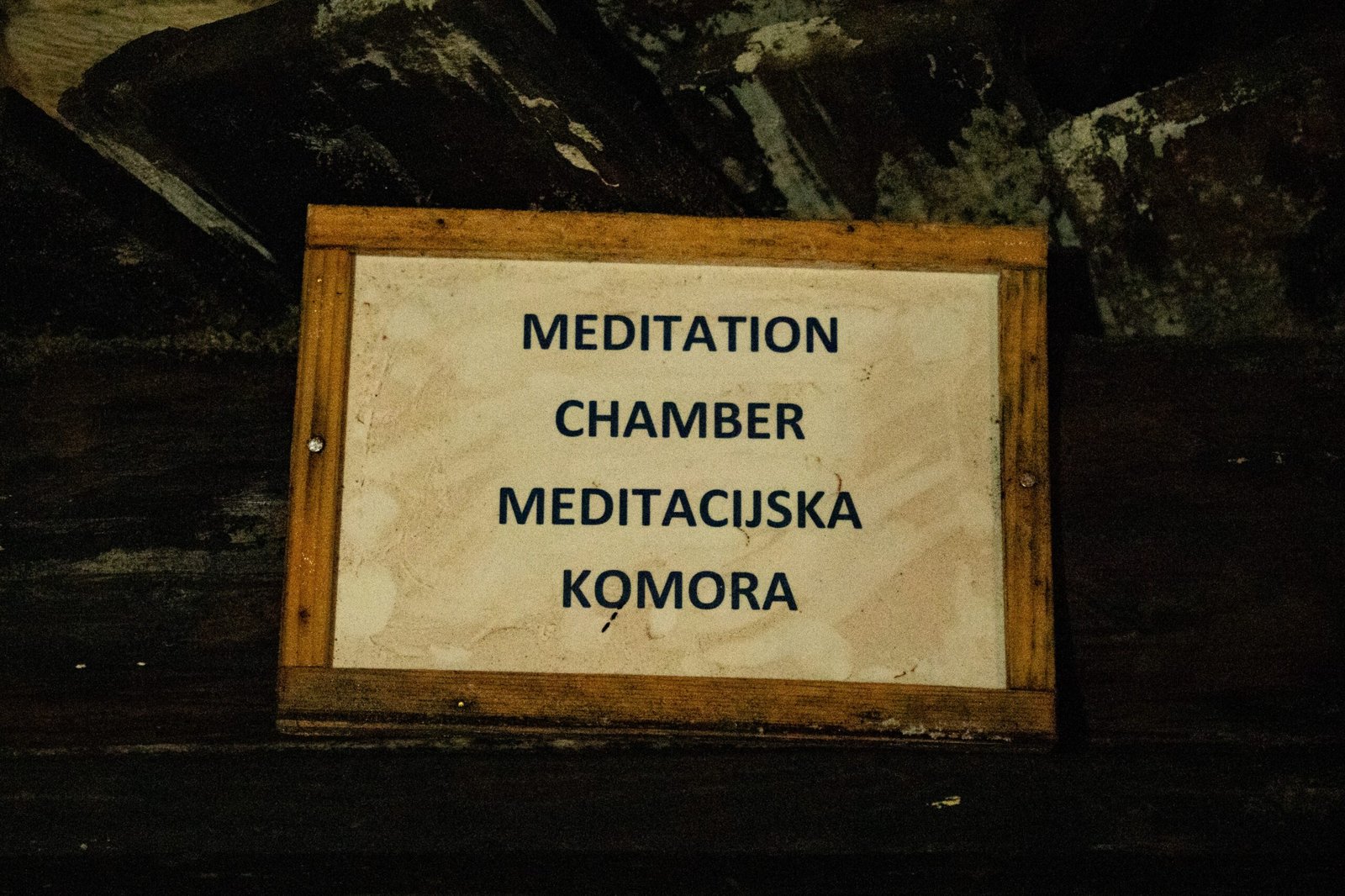 A sign that reads "meditation chamber" inside the tunnels of the pyramids