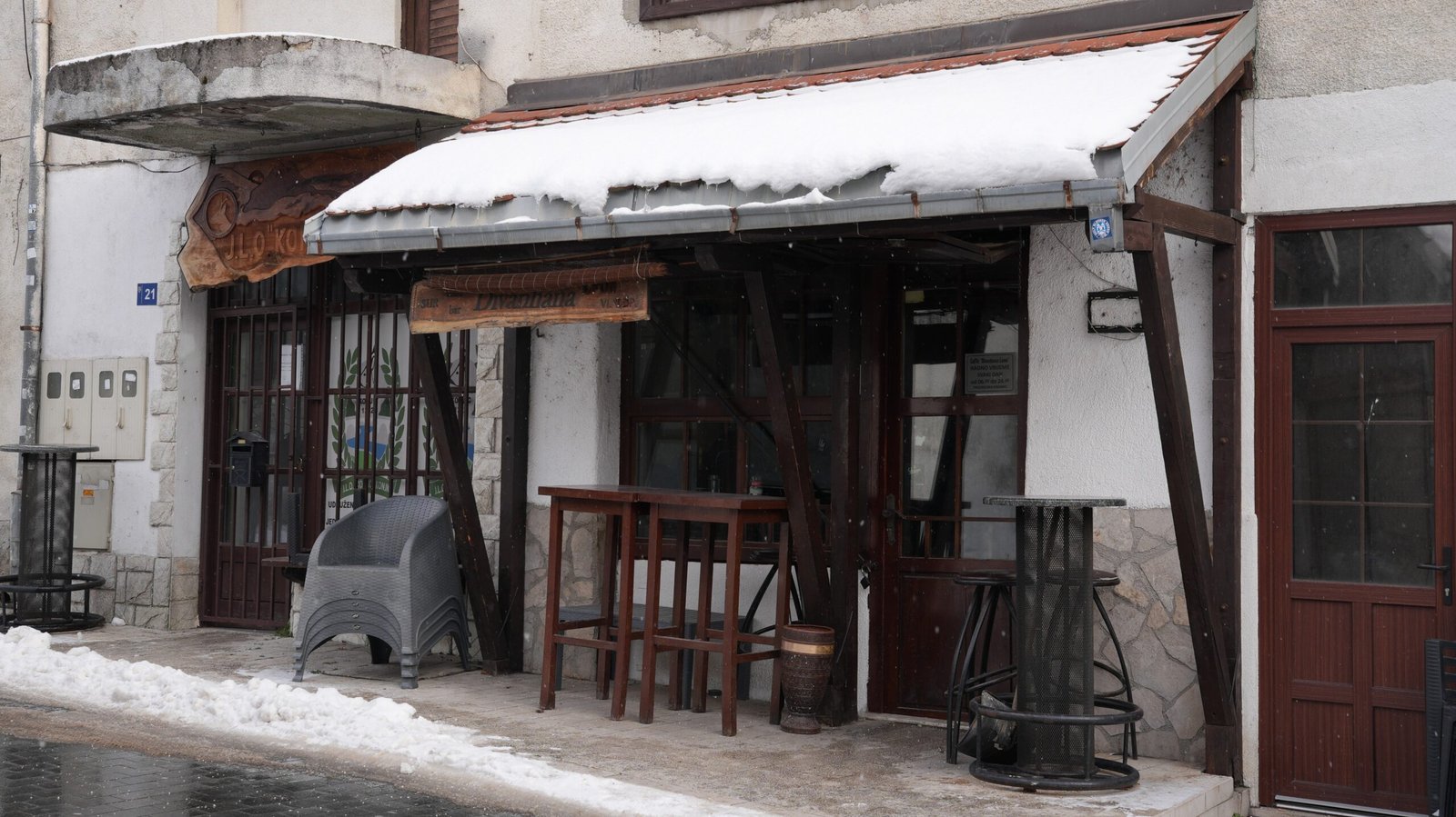 A cozy cafe in winter time covered in snow