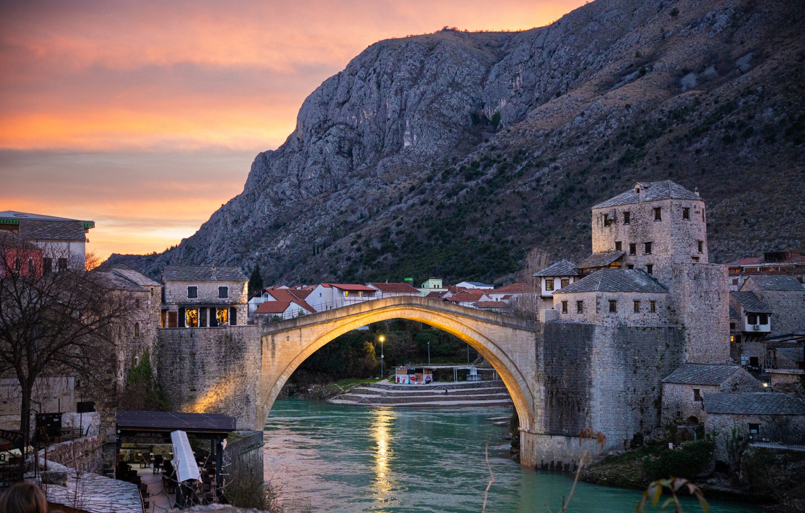 Mostar and Stari Most bridge under an orange sky, perfect for Mostar Travel Guide