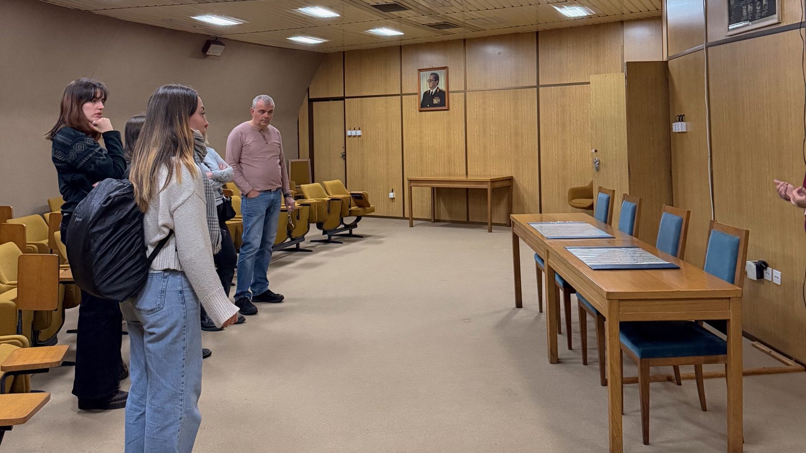 A group of people on a tour inside a seminar room