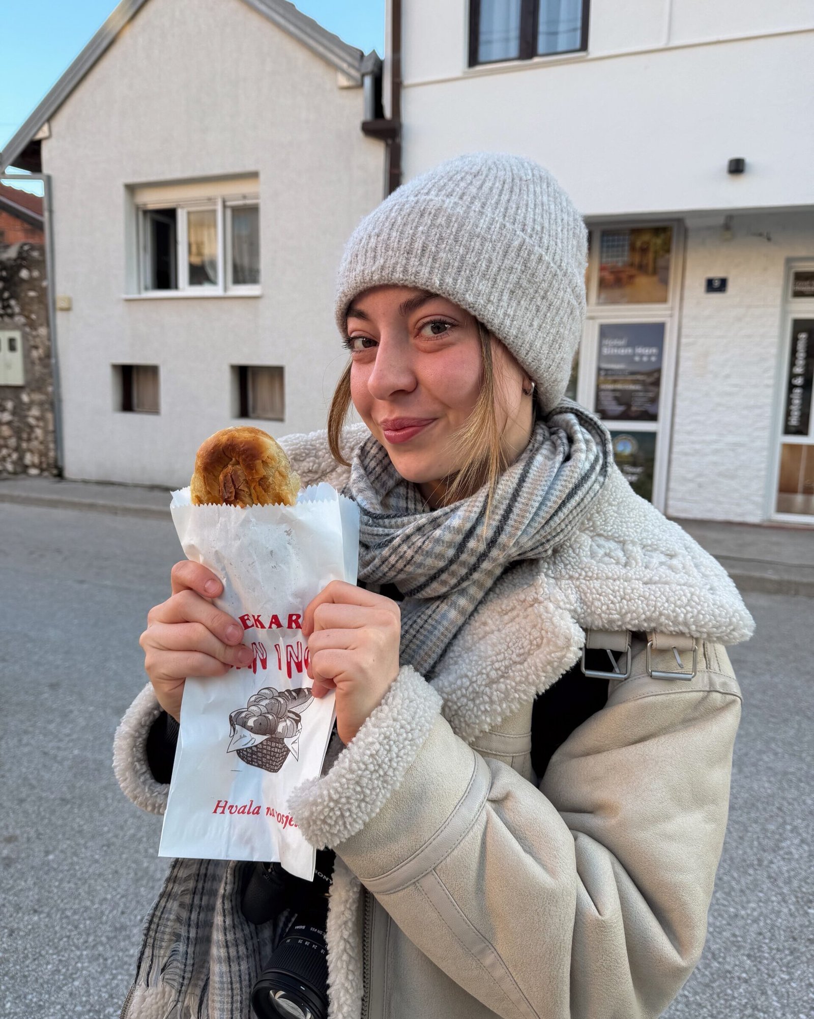 A women stood in the streets of Mostar with a burek